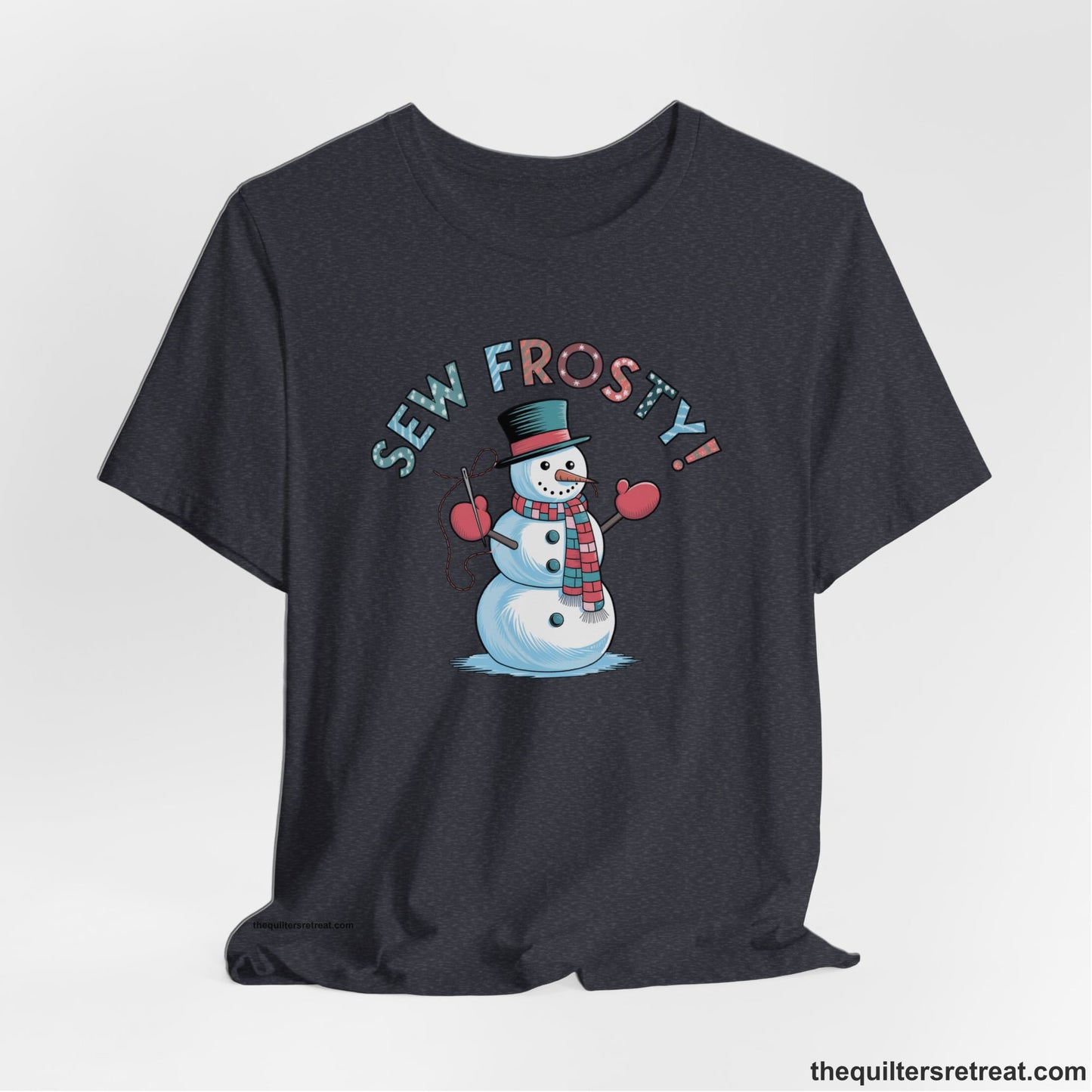 A Heather Navy Short Sleeve T-Shirt with a playful snowman sewing illustration with "Sew Frosty!" text in a festive style