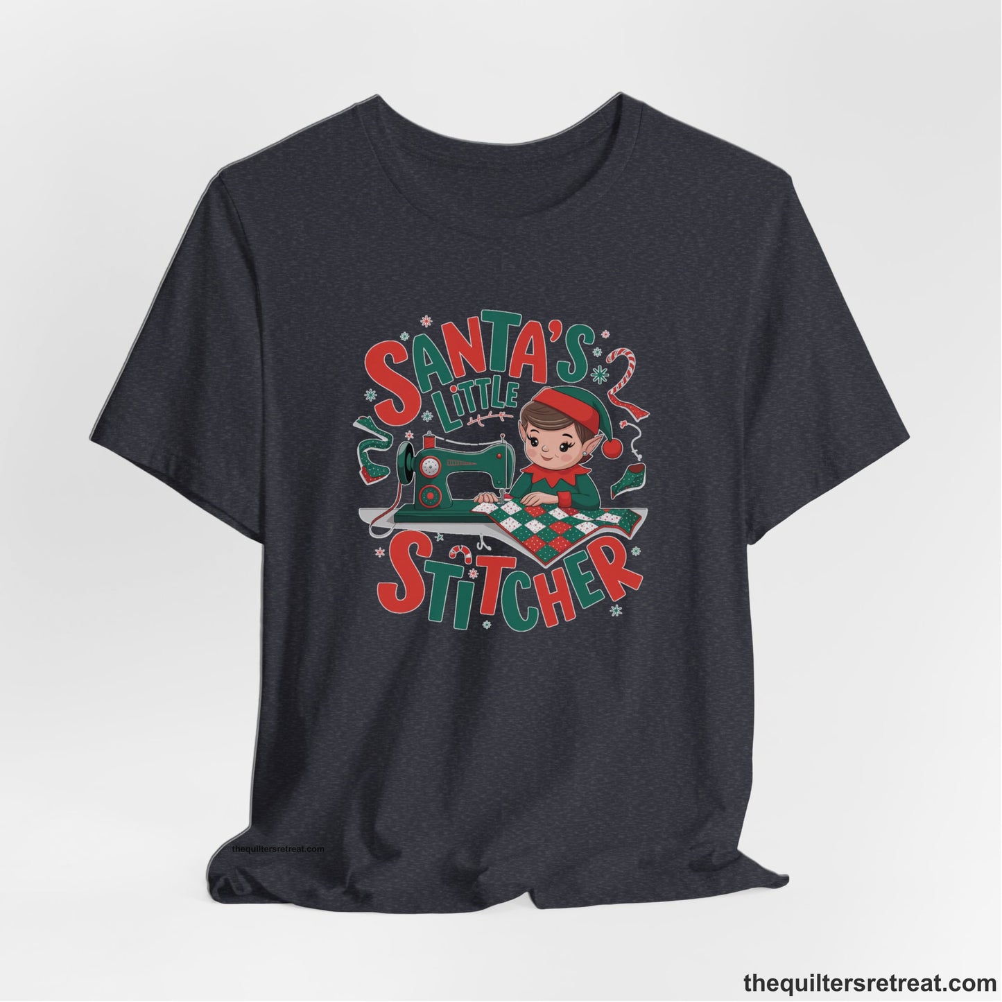 A Heather Navy Short Sleeve T-Shirt with a santa's little stitcher elf sewing quilt with festive colors in playful style