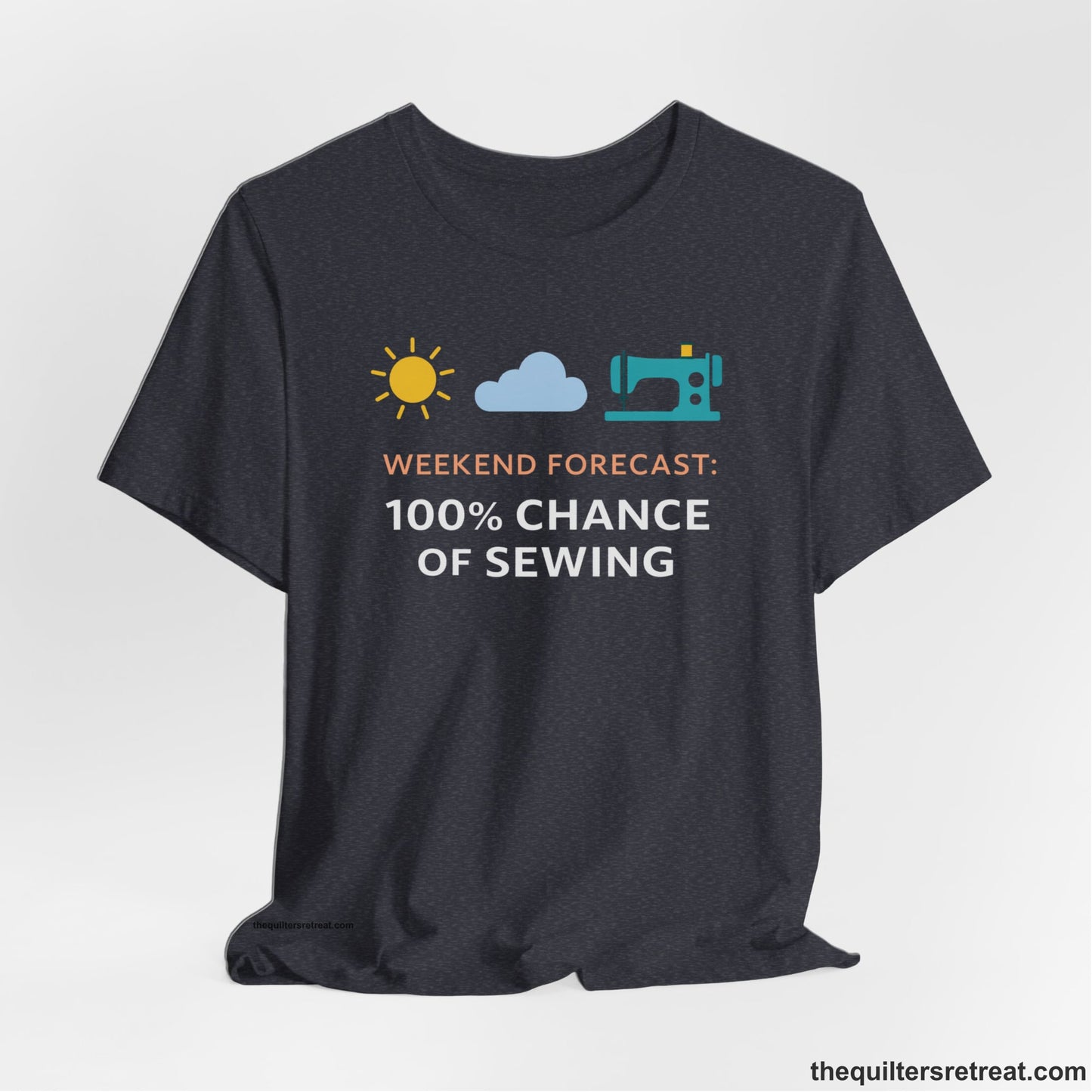 A Heather Navy Short Sleeve T-Shirt with a Sun, cloud, sewing machine icons; bold text "Weekend Forecast: 100% Chance of Sewing"; playful style.