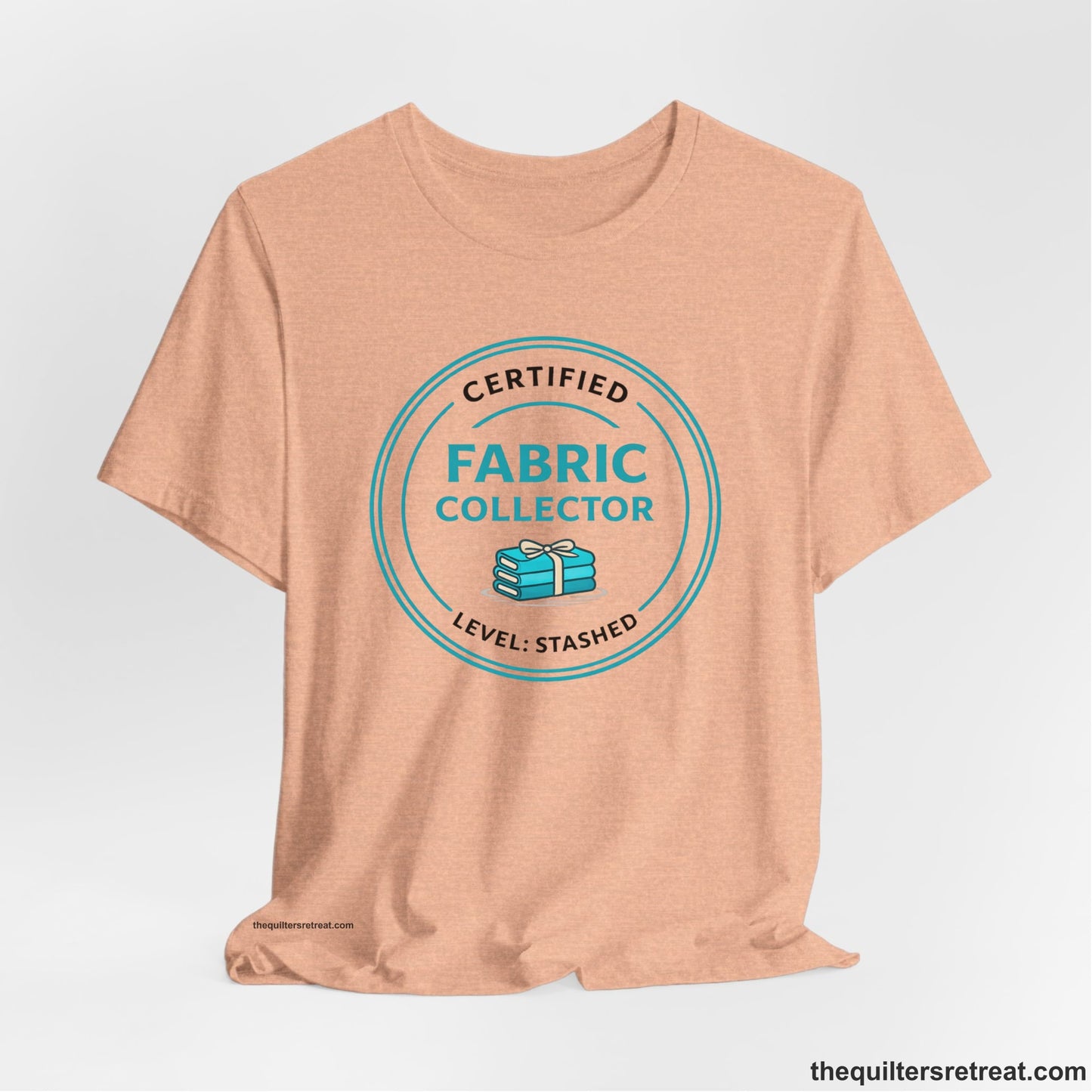 A  Short Sleeve T-Shirt featuring a playful design about fabric collecting.