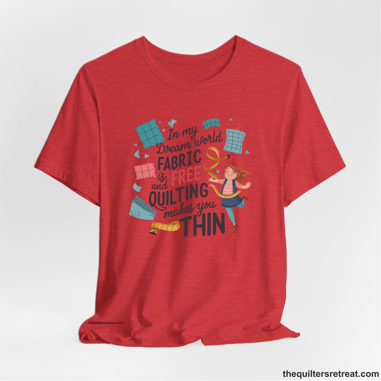 A Heather Red Short Sleeve T-Shirt with a inspirational quilting text with playful seamstress and colorful fabric scraps in whimsical style