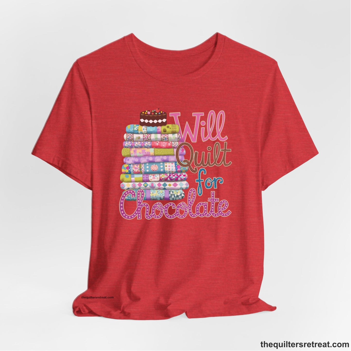 A Heather Red Short Sleeve T-Shirt with a stack of colorful quilts topped with cake, whimsical "Will Quilt for Chocolate" text