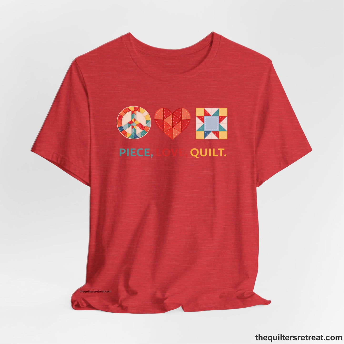 A Heather Red Short Sleeve T-Shirt with a Colorful quilt patterns, "PIECE, LOVE, QUILT." text, whimsical style.