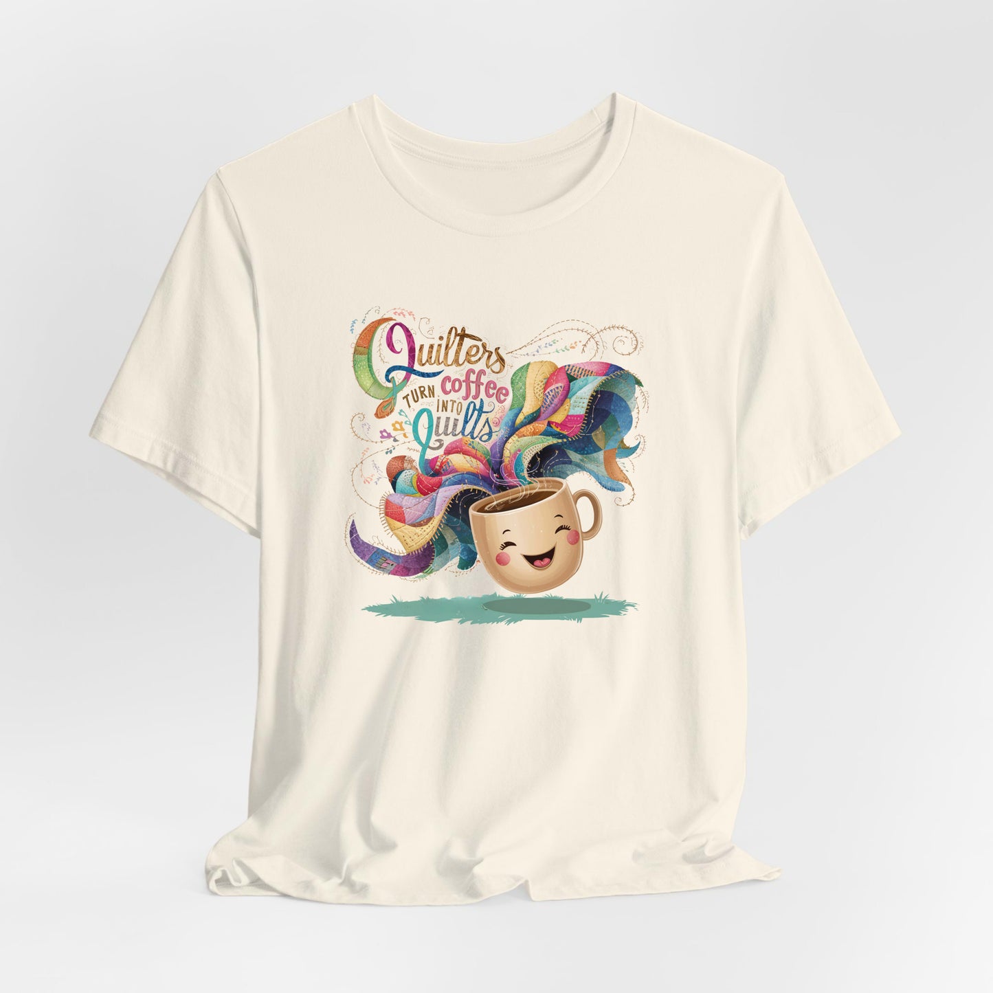 A Natural Short Sleeve T-Shirt with a quirky "Quilters Turn Coffee into Quilts" text with vibrant swirling patterns