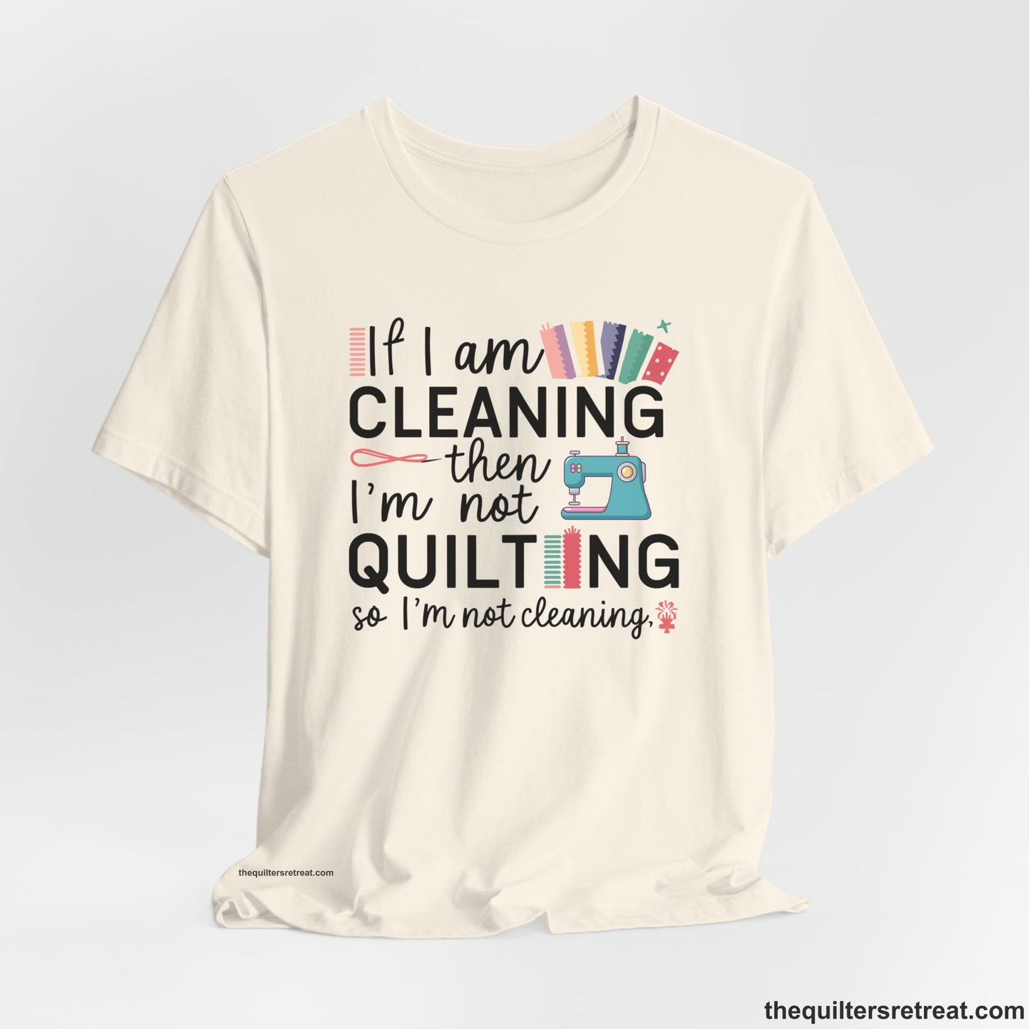 A Natural Short Sleeve T-Shirt with a If I am cleaning then I'm not quilting text with sewing machine and fabric graphics