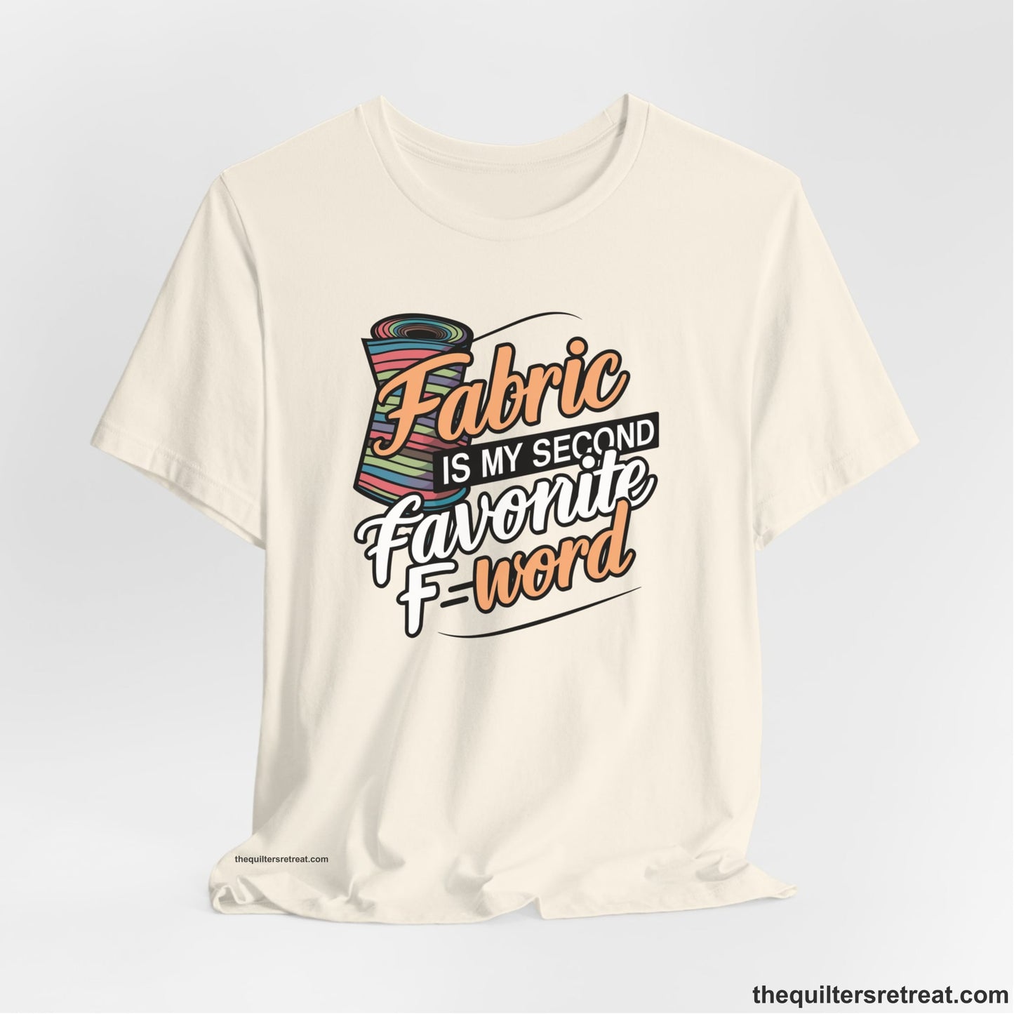 A Natural Short Sleeve T-Shirt with a fabric bolt illustration with bold "Fabric Is My Second Favorite F Word" text