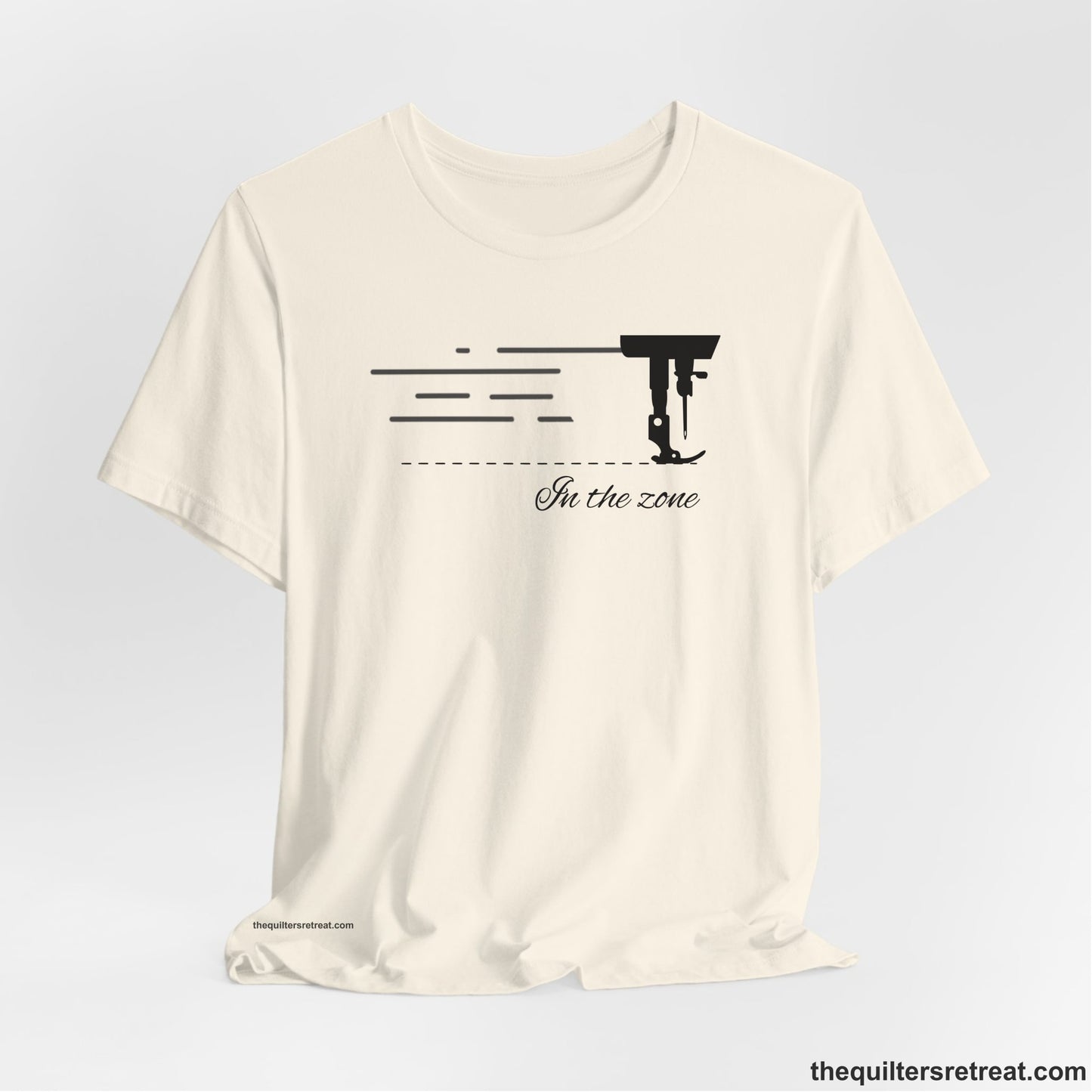 A Natural Short Sleeve T-Shirt with a vintage sewing machine illustration with floral accents and "Sewing Mends the Soul" text