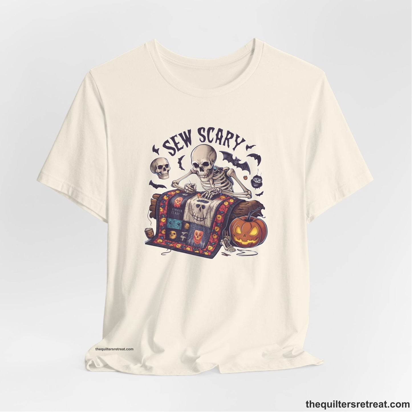 A Natural Short Sleeve T-Shirt with a skeleton quilting with spooky accents and "Sew Scary" text in a Halloween theme