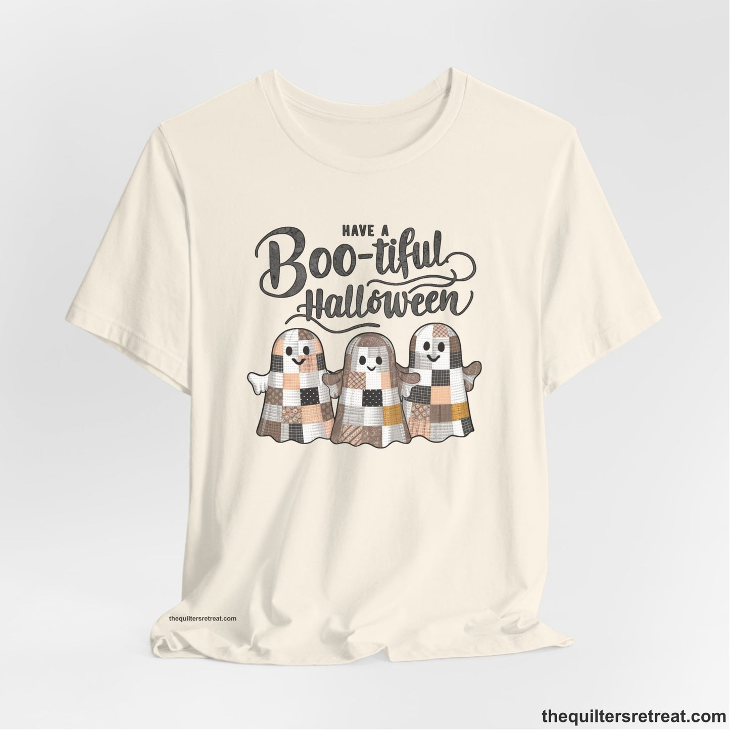 A Natural Short Sleeve T-Shirt with a cute patchwork ghosts with "Boo-tiful Halloween" text in a playful style