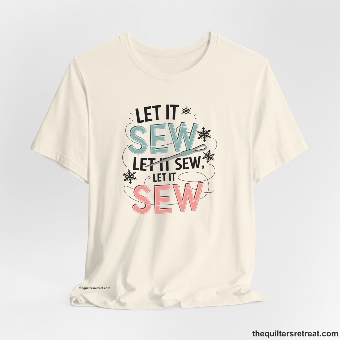 A Natural Short Sleeve T-Shirt with a bold "SEW" text with needle and thread in a modern style
