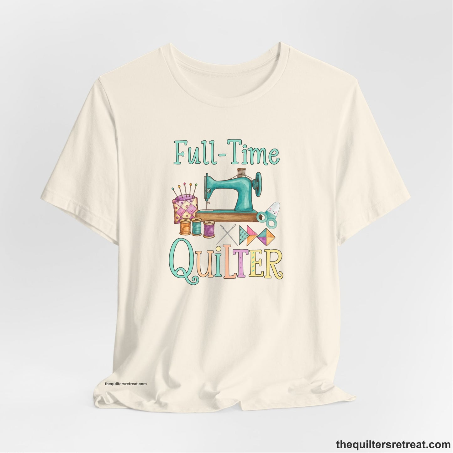 A Natural Short Sleeve T-Shirt with a vintage sewing machine with colorful threads and "Full-Time Quilter" text in playful style