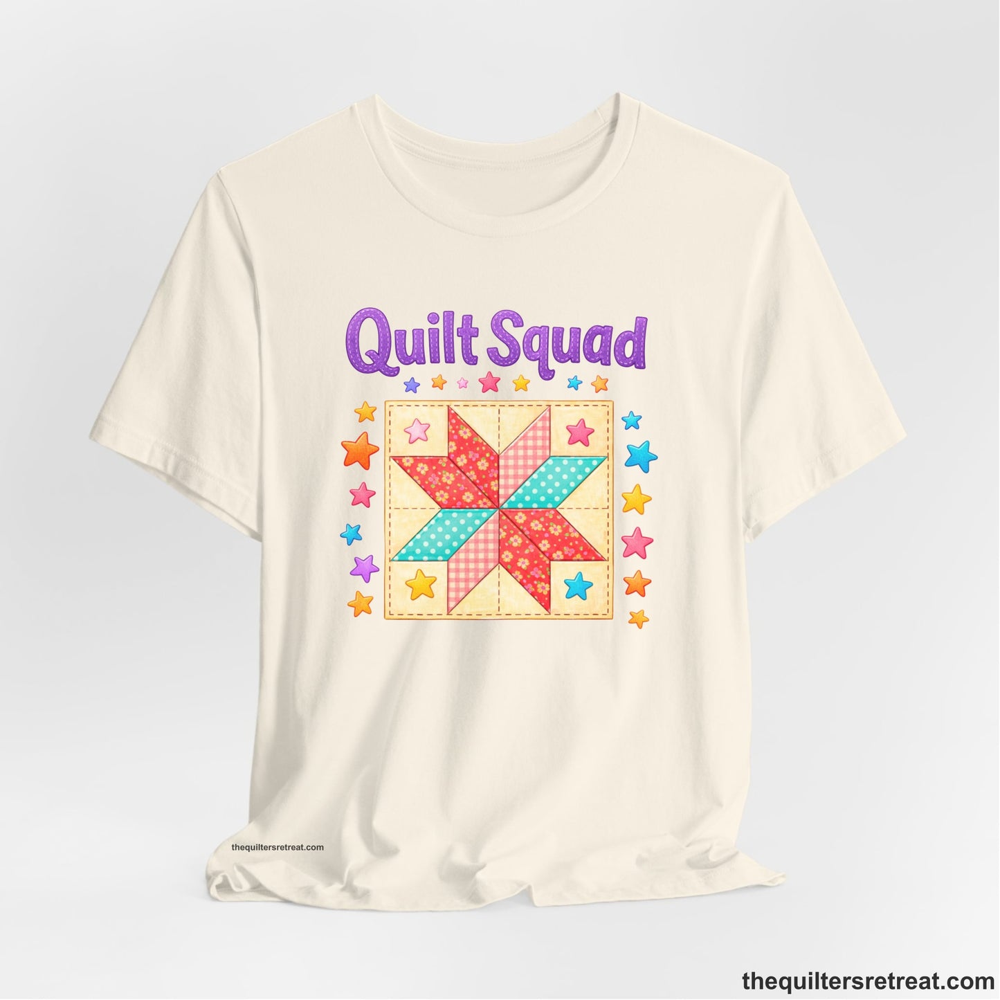 A Natural Short Sleeve T-Shirt with a Patchwork quilt star with colorful stars, playful mood, "Quilt Squad" text.
