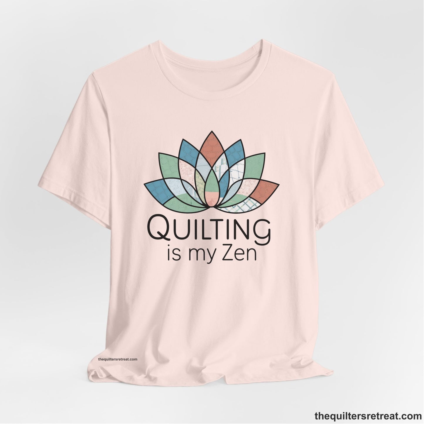A Soft Pink Short Sleeve T-Shirt with a floral quilt pattern with "Quilting is my Zen" text in a calm, soothing design