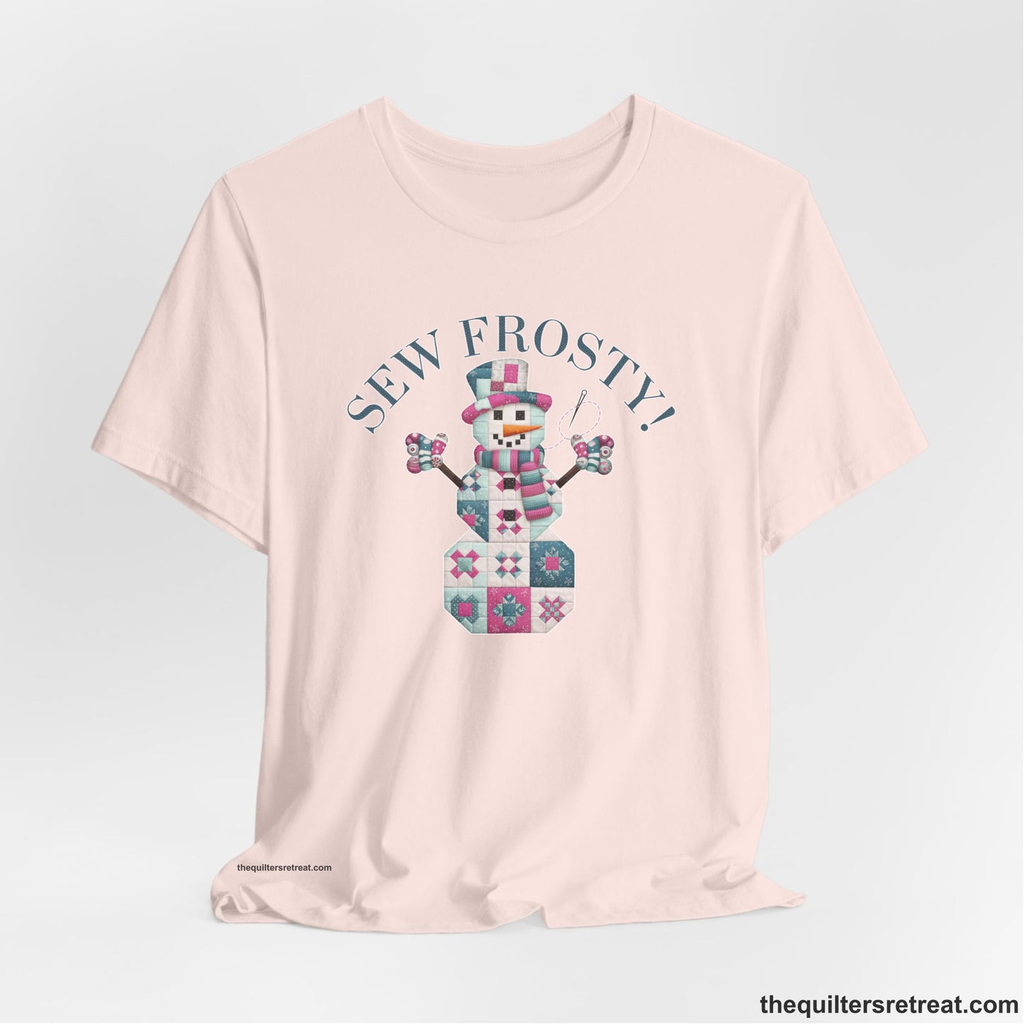 A Soft Pink Short Sleeve T-Shirt with a snowman quilt pattern with "Sew Frosty!" text in a crafty style