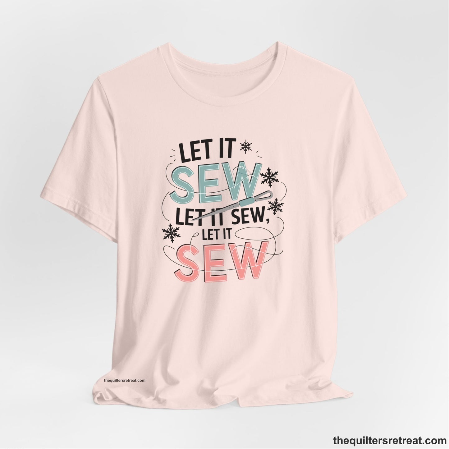 A Soft Pink Short Sleeve T-Shirt with a bold "SEW" text with needle and thread in a modern style