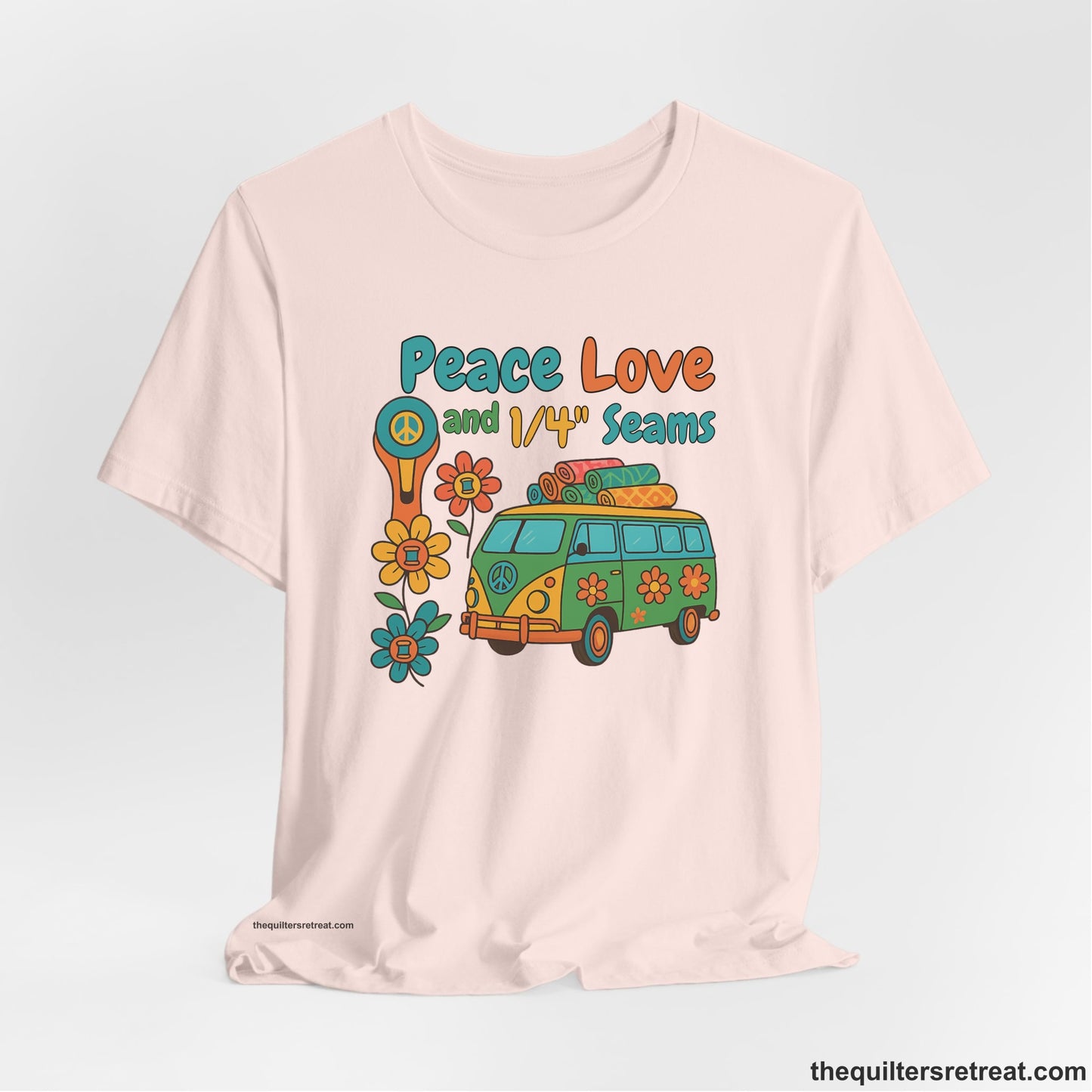 A Soft Pink Short Sleeve T-Shirt with a peace sign van with colorful flowers and "Peace Love and 1/4 Seams" text in retro style