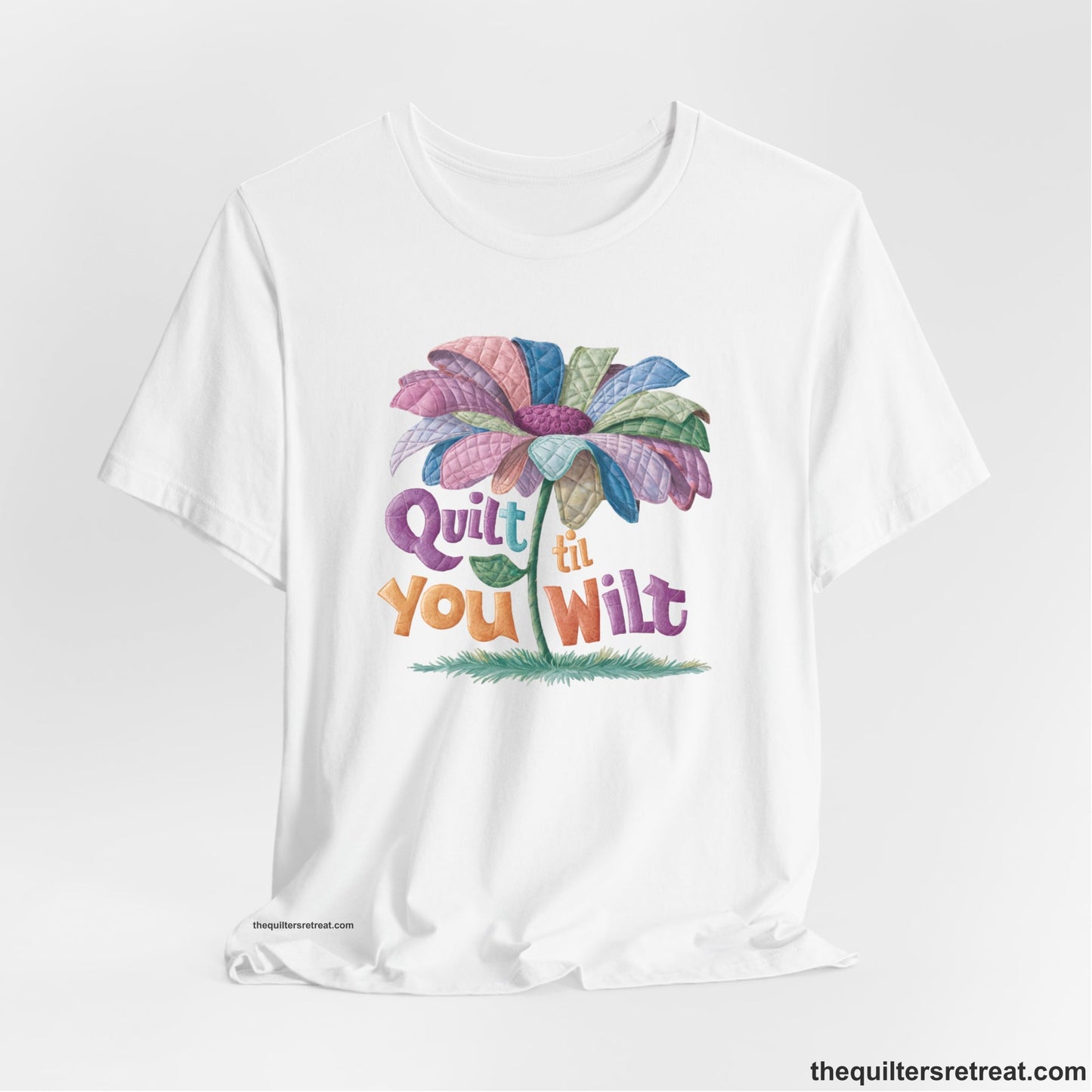 A White Short Sleeve T-Shirt with a whimsical quilted flower with bold "Quilt til You Wilt" text