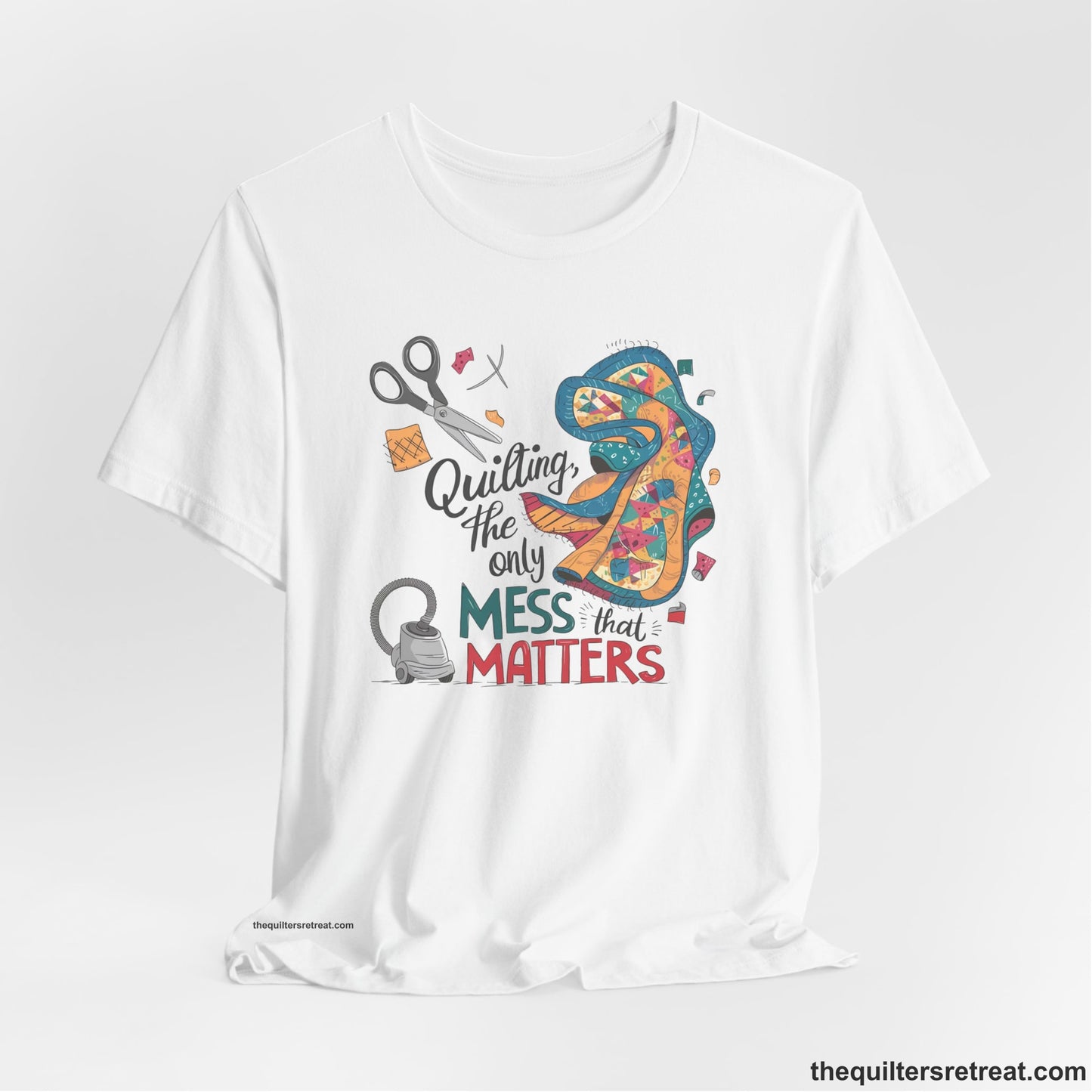 A Short Sleeve T-Shirt with a quilting tools and patchwork pieces with bold "Quilting, the only mess that matters" text