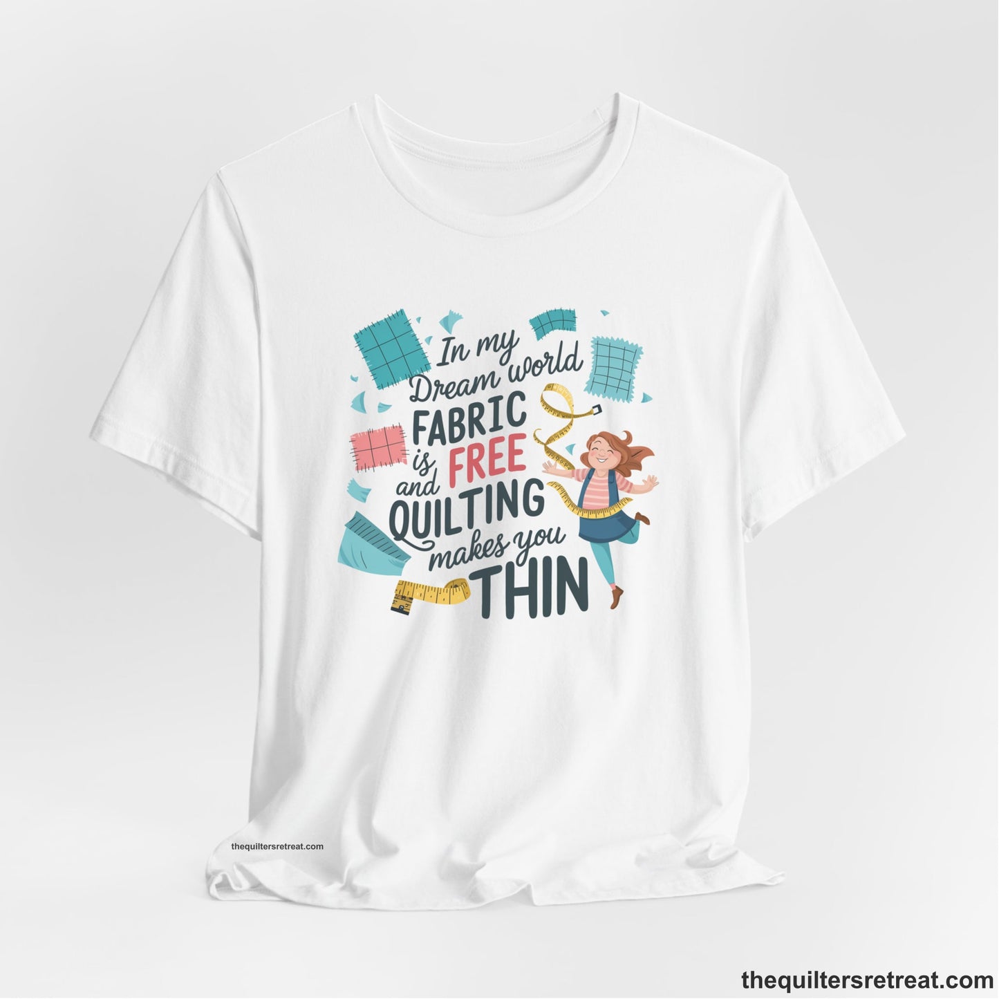 A White Short Sleeve T-Shirt with a inspirational quilting text with playful seamstress and colorful fabric scraps in whimsical style