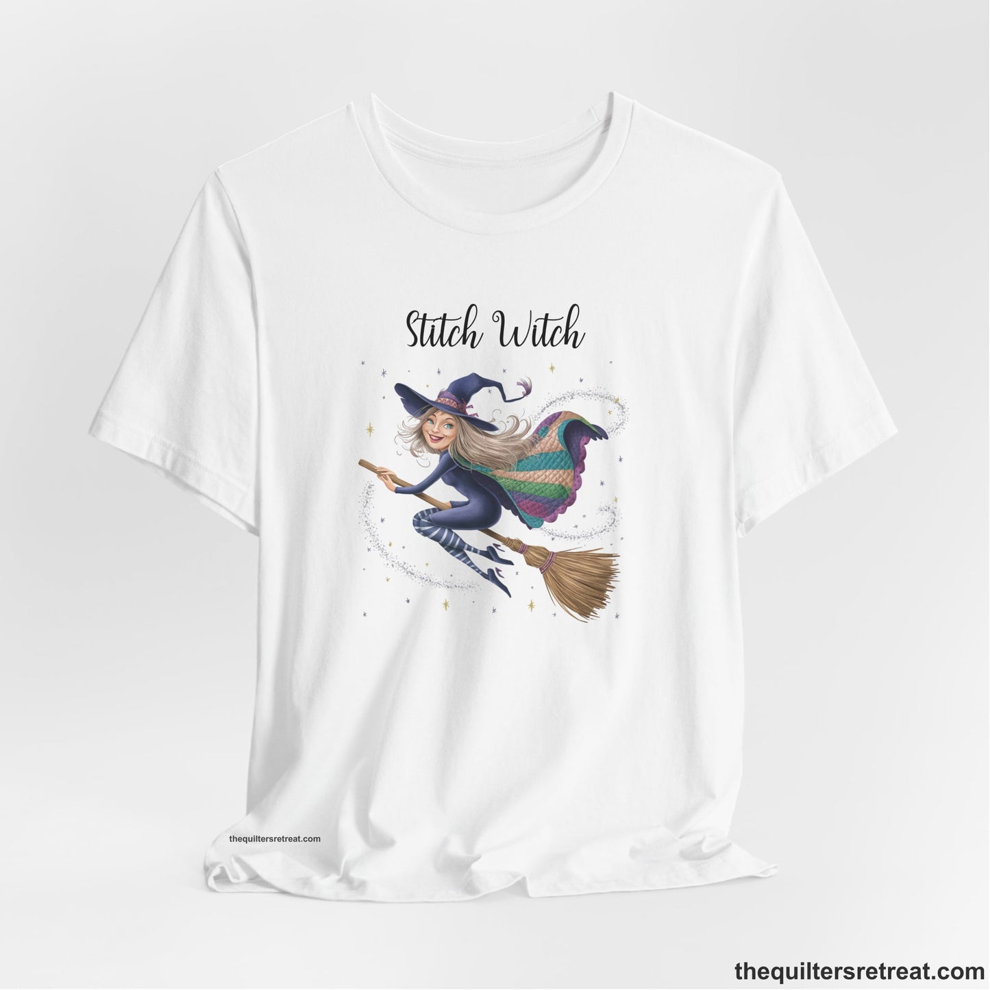 A White Short Sleeve T-Shirt with a playful witch on broomstick with patchwork cape and starry background in a whimsical style