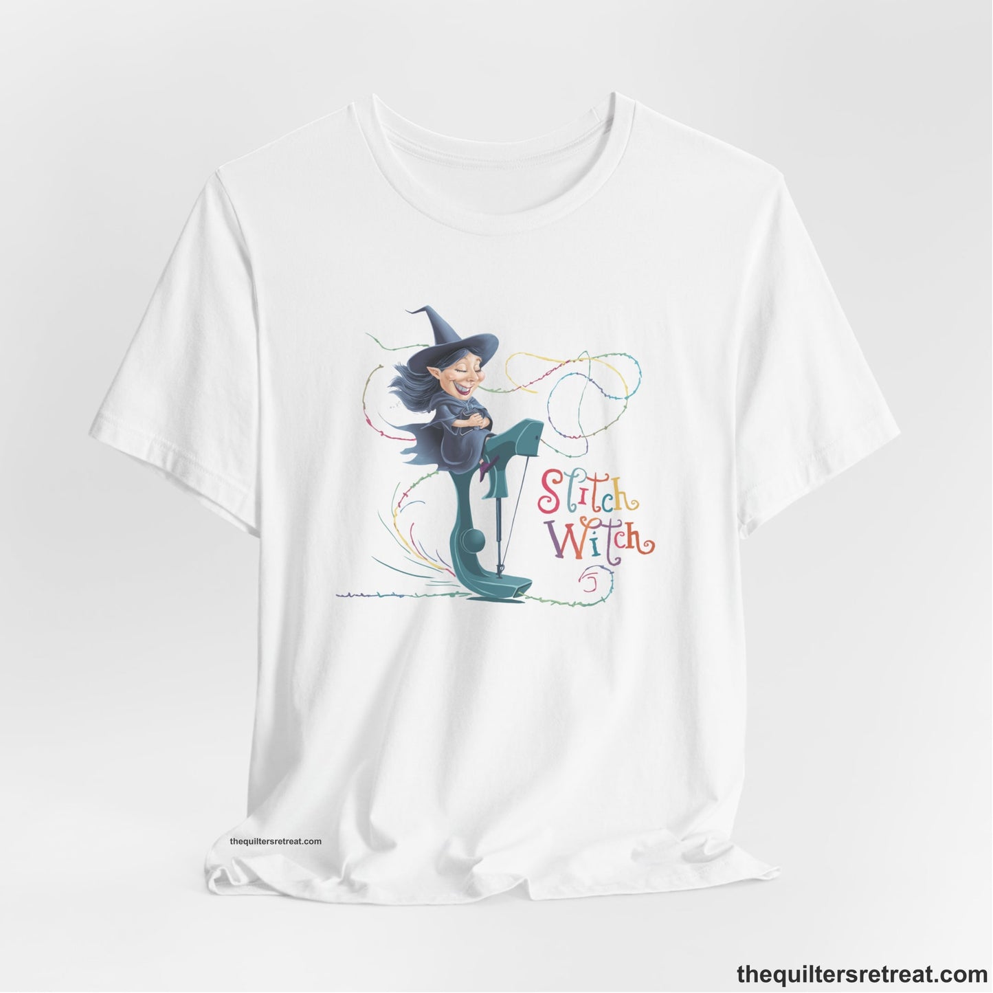 A White Short Sleeve T-Shirt with a witch on vintage sewing machine with "Stitch Witch" text in playful, colorful style