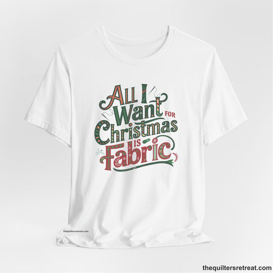 A White Short Sleeve T-Shirt with a vintage holiday text "All I Want for Christmas is Fabric" with festive motifs