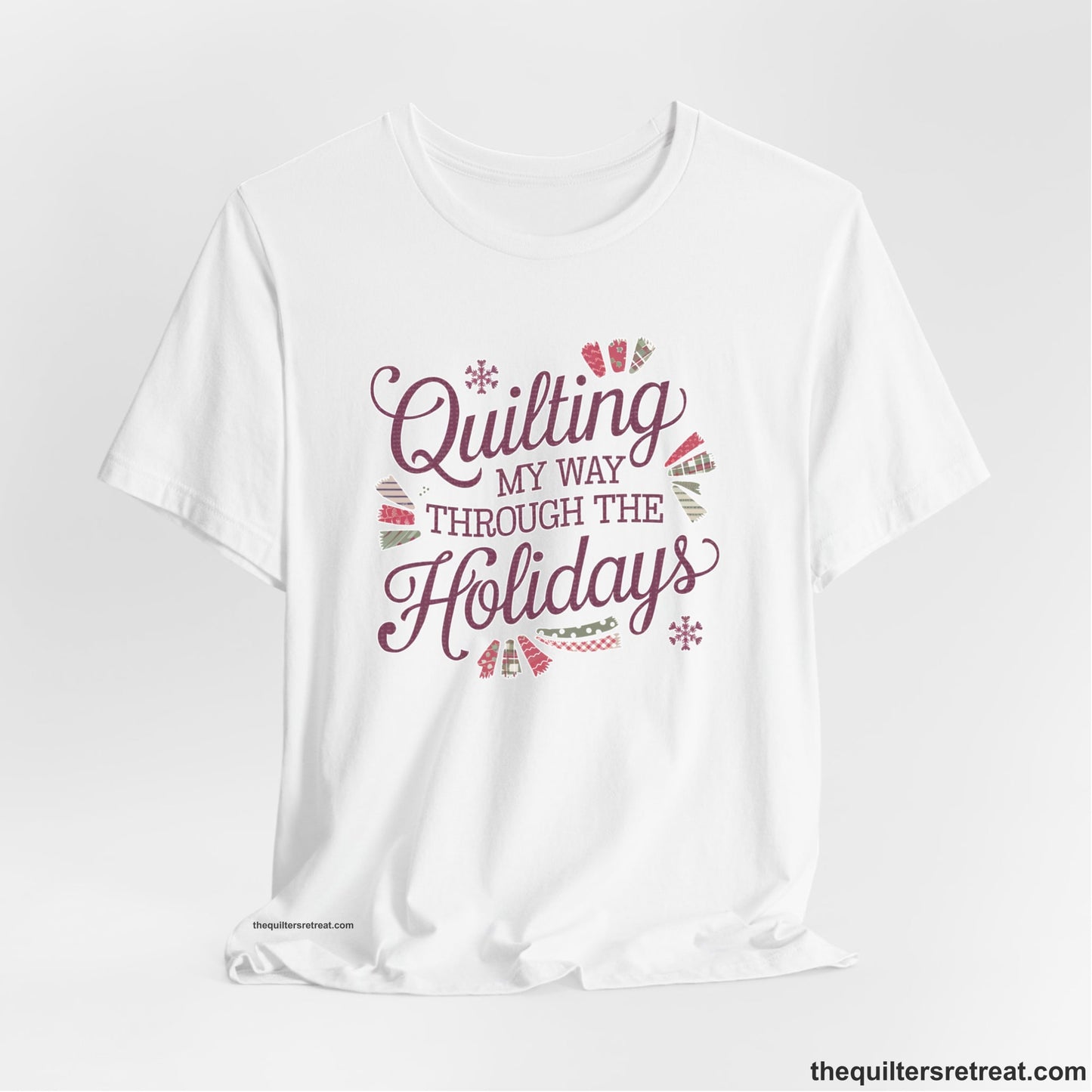 A White Short Sleeve T-Shirt with a quilting-themed text in festive colors with decorative quilt patterns
