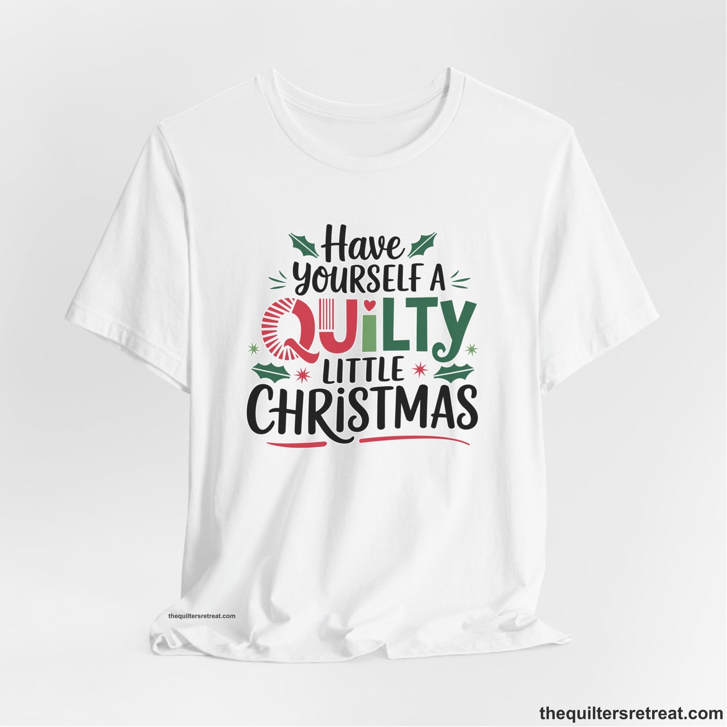 A White Short Sleeve T-Shirt with a festive "Have Yourself a Quilty Little Christmas" text with holly and quilt patterns