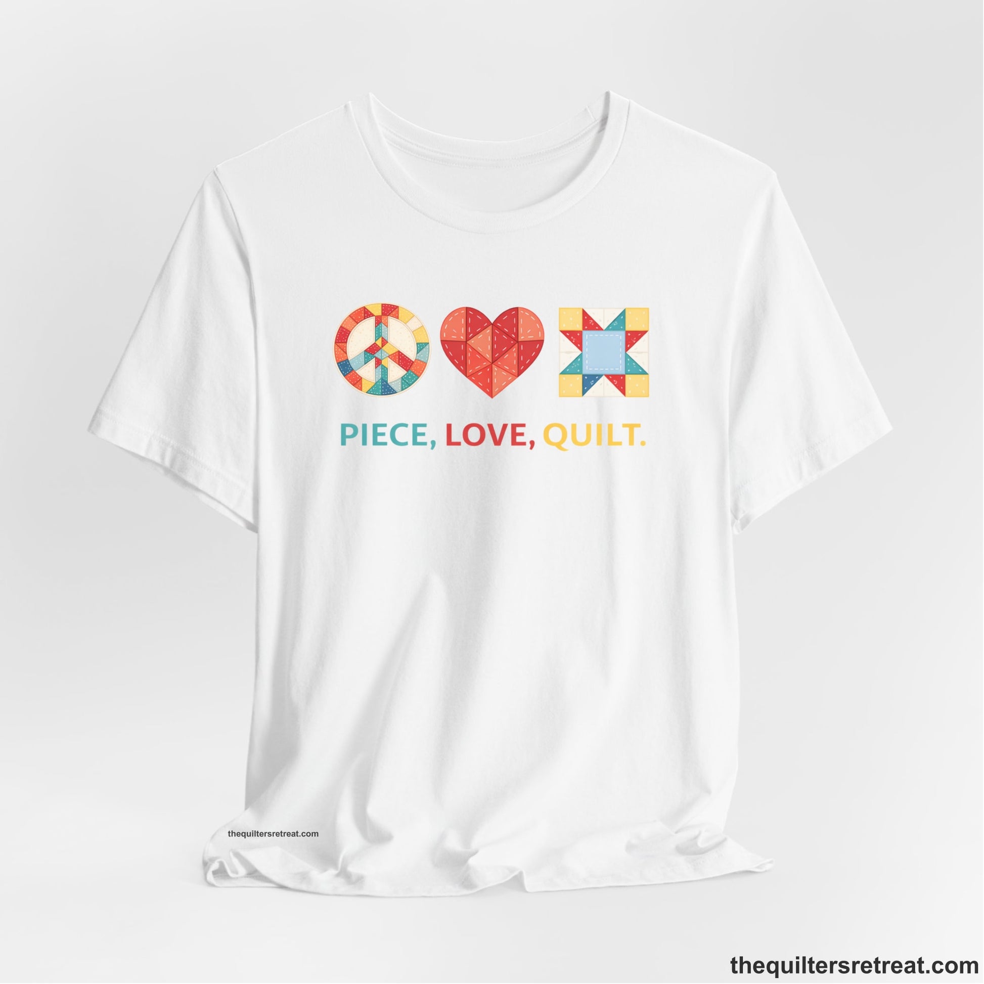A White Short Sleeve T-Shirt with a Colorful quilt patterns, "PIECE, LOVE, QUILT." text, whimsical style.