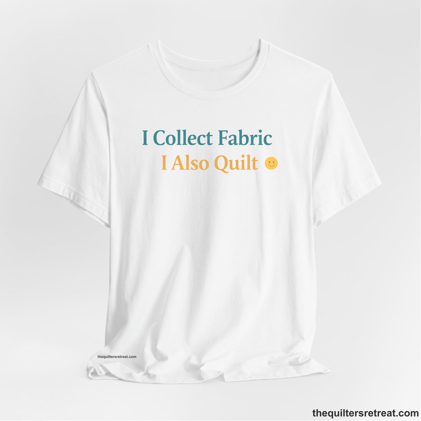 A White Short Sleeve T-Shirt with a Colorful text saying "I Collect Fabric I Also Quilt" with a playful, cheerful vibe.