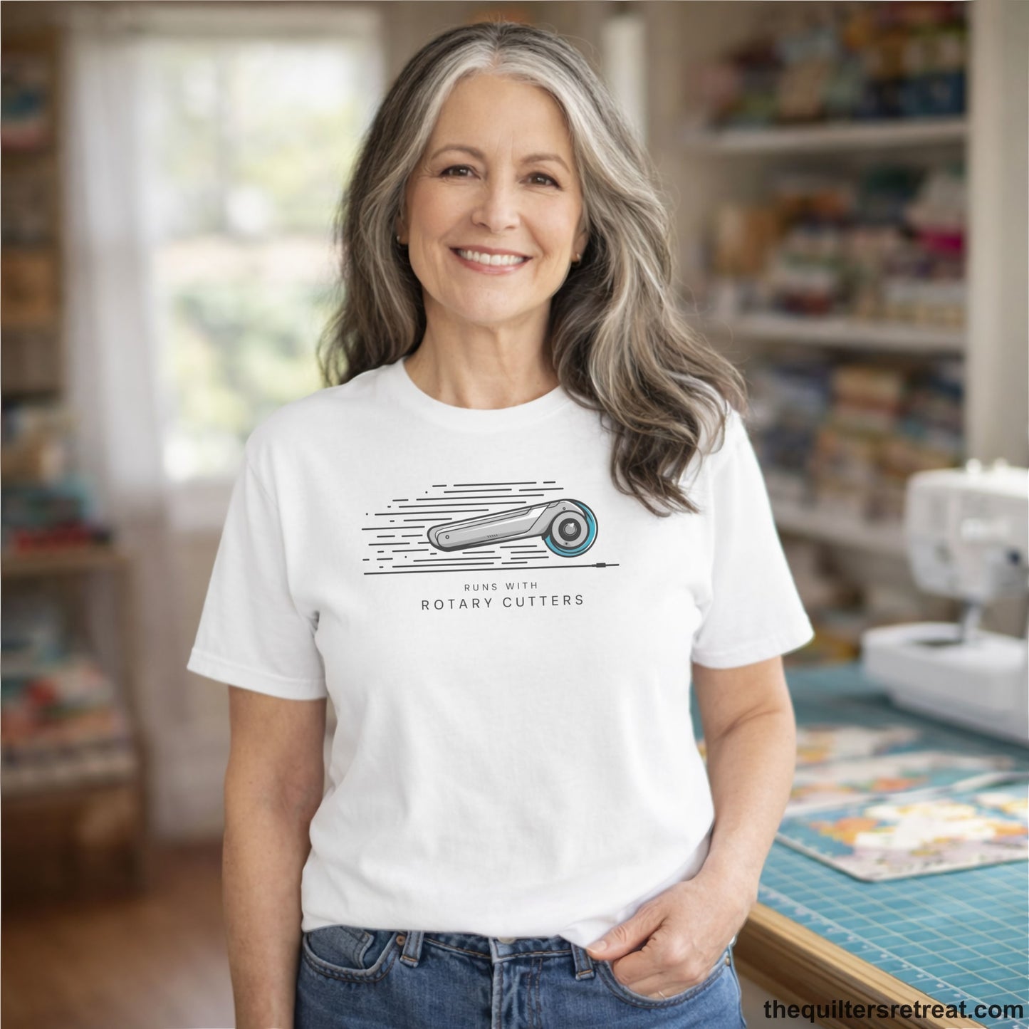 A White Short Sleeve T-Shirt with a rotary cutter illustration with dynamic lines and bold "Runs with Rotary Cutters" text